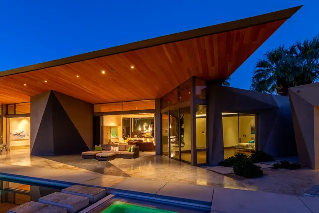 a bathroom with a toilet and a mirror