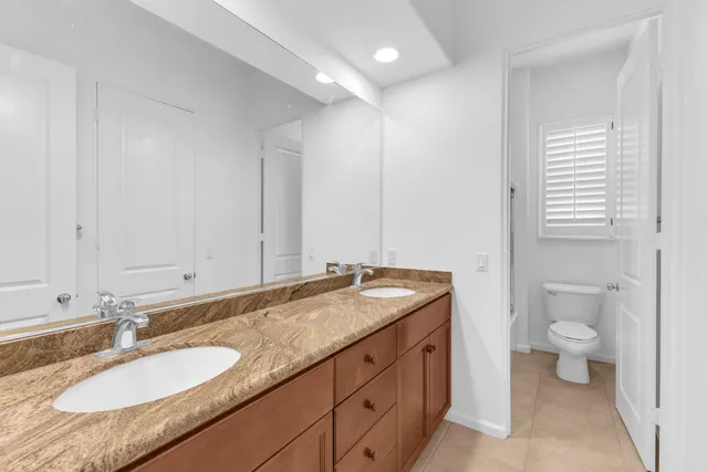 a bathroom with a shower and toilet