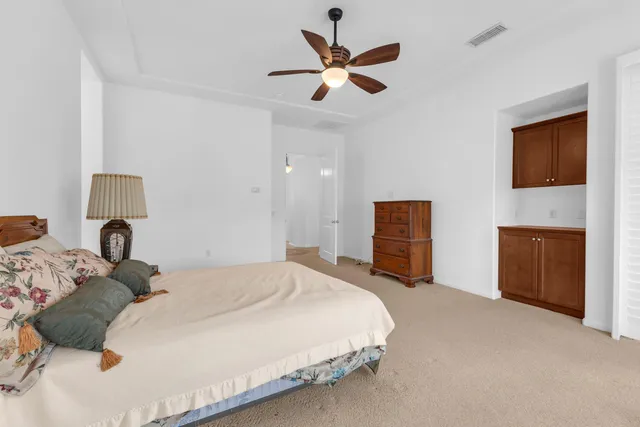 a spacious bathroom with a granite countertop tub sink and mirror