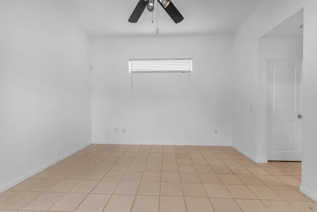 a view of an empty room and window