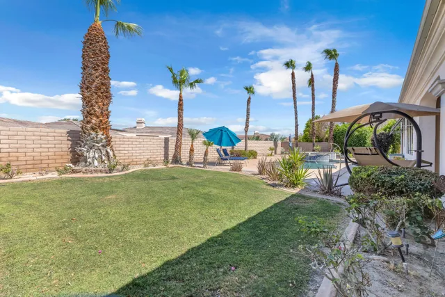 a view of a garden with a lake view