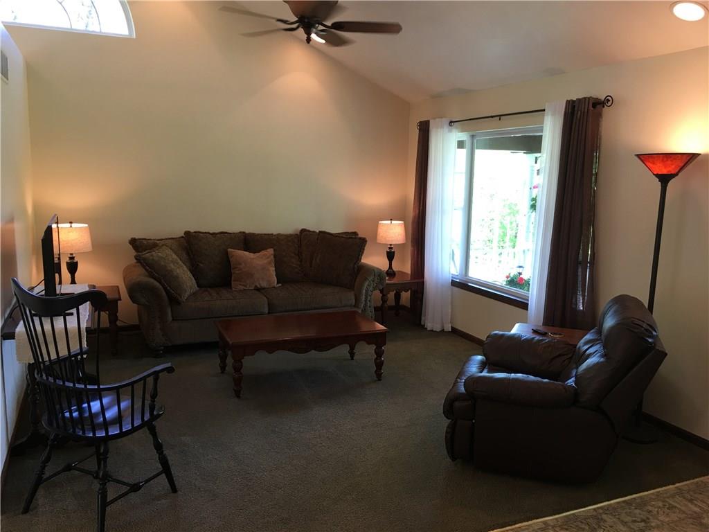 704 Red Mill Road Kittanning, PA 16201 - Photo 2 of 25 Living Room with large arched window, cathedral ceiling with recessed lighting, and bright front window!