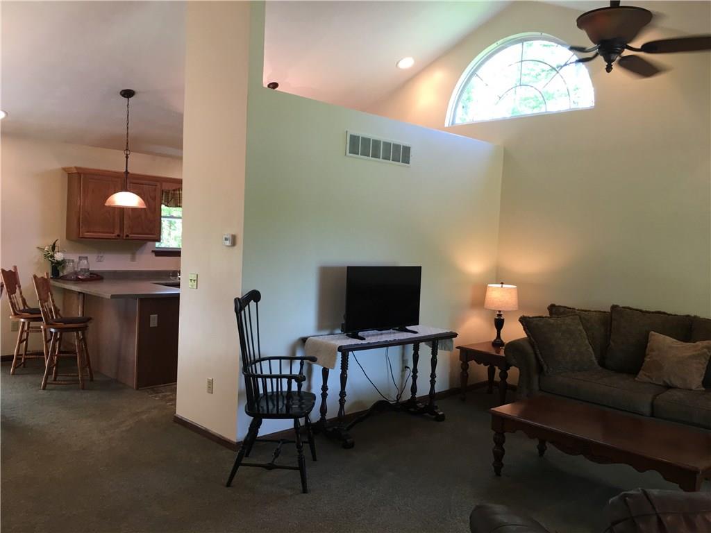 704 Red Mill Road Kittanning, PA 16201 - Photo 11 of 25 Large open concept Living Room/Kitchen/Dining Room with large arched window and cathedral ceiling with recessed lighting!
