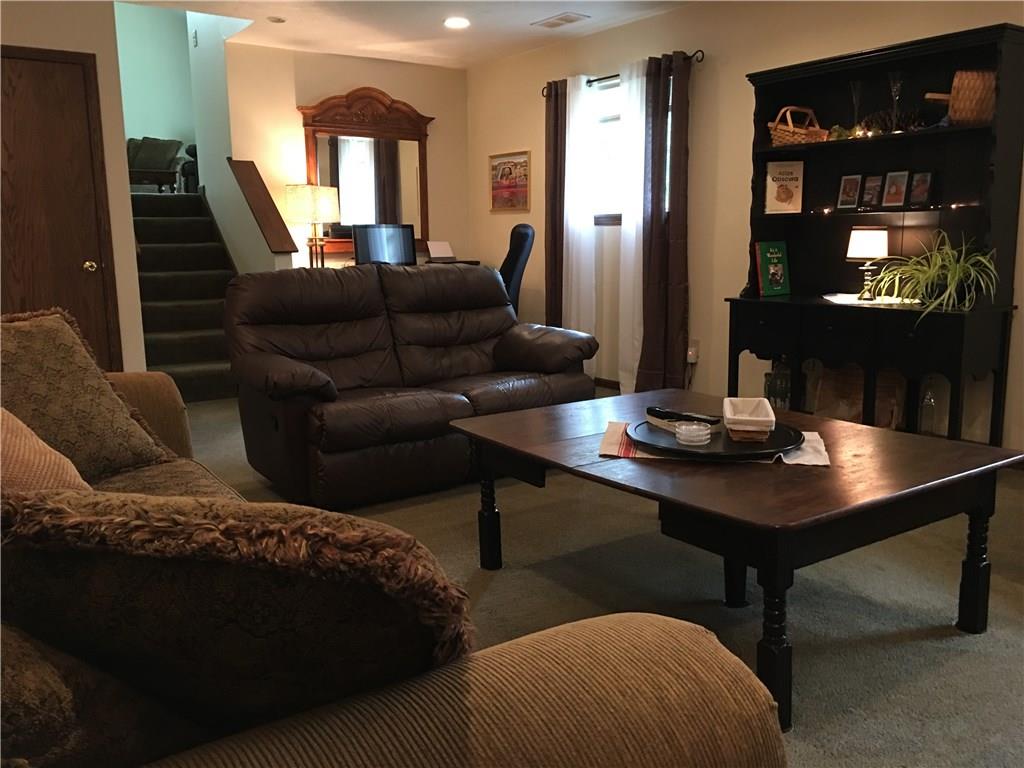 704 Red Mill Road Kittanning, PA 16201 - Photo 12 of 25 Cozy Family Room with gas log fireplace flanked by custom lighted built-ins and storage closet!