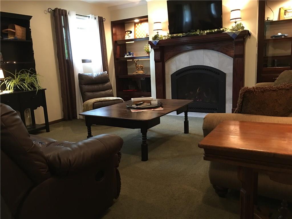 704 Red Mill Road Kittanning, PA 16201 - Photo 13 of 25 Cozy Family Room with gas log fireplace flanked by custom lighted built-ins!