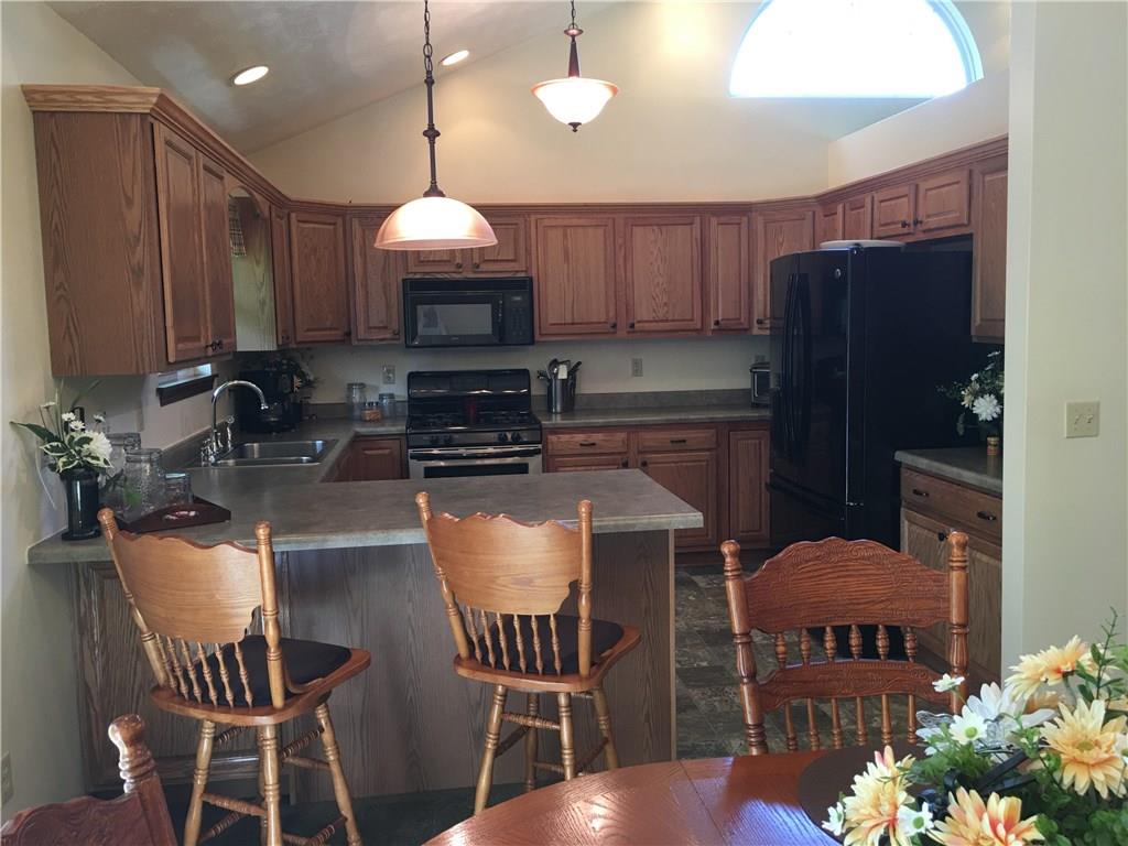 704 Red Mill Road Kittanning, PA 16201 - Photo 3 of 25 Large Kitchen with lots of cabinets, newer appliances, large arched window and cathedral ceiling with recessed lighting!