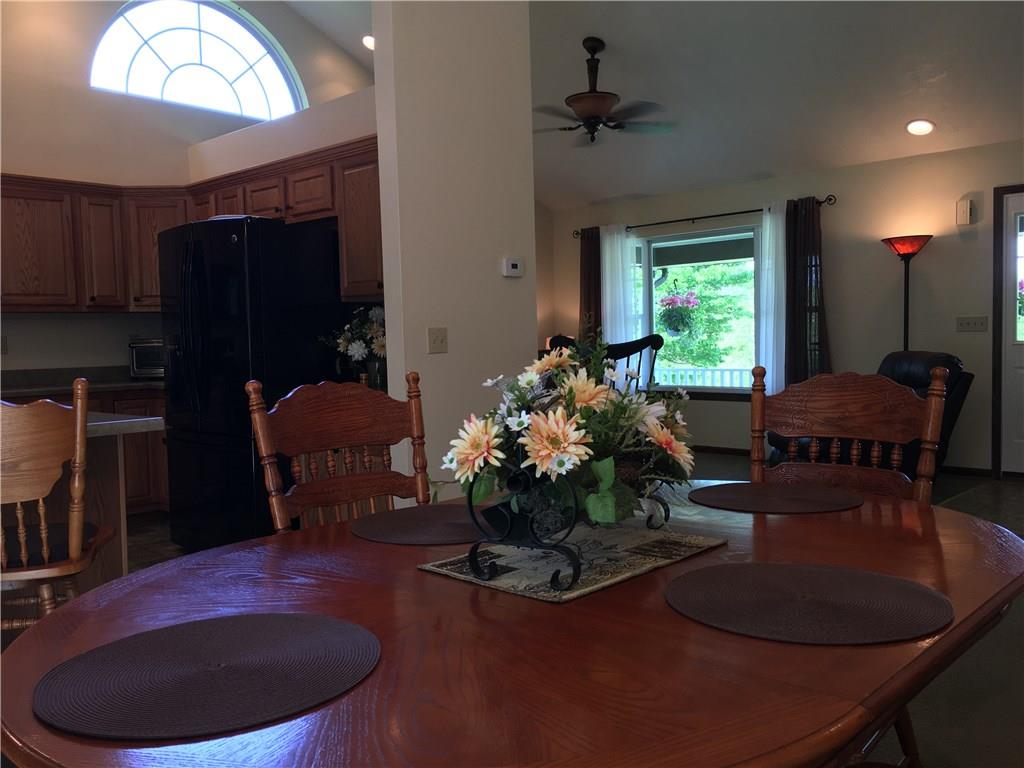 704 Red Mill Road Kittanning, PA 16201 - Photo 4 of 25 Large open concept Dining Room/Kitchen/Living Room with large arched window and cathedral ceiling with recessed lighting!