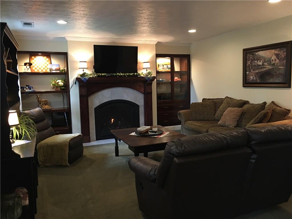 704 Red Mill Road Kittanning, PA 16201 - Photo 5 of 25 Cozy Family Room with gas log fireplace flanked by custom lighted built-ins!