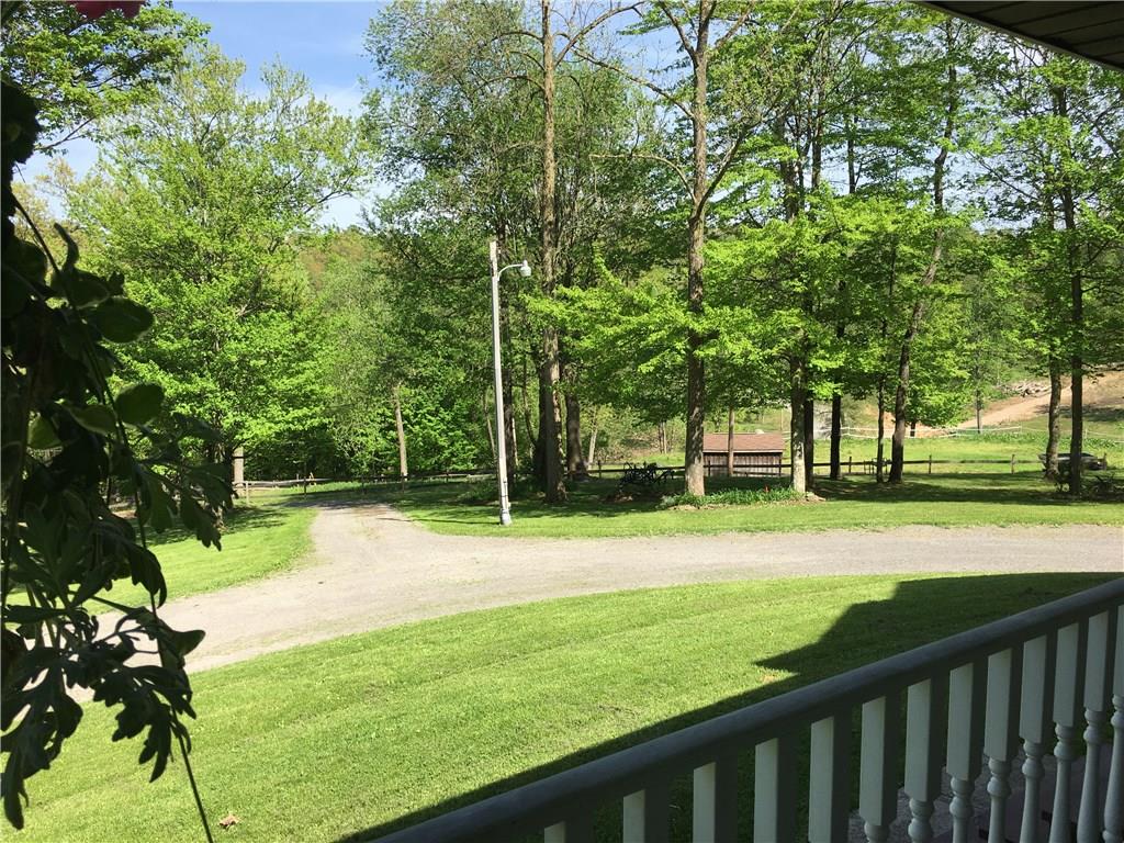 704 Red Mill Road Kittanning, PA 16201 - Photo 8 of 25 Peaceful view of front yard from the large covered porch!