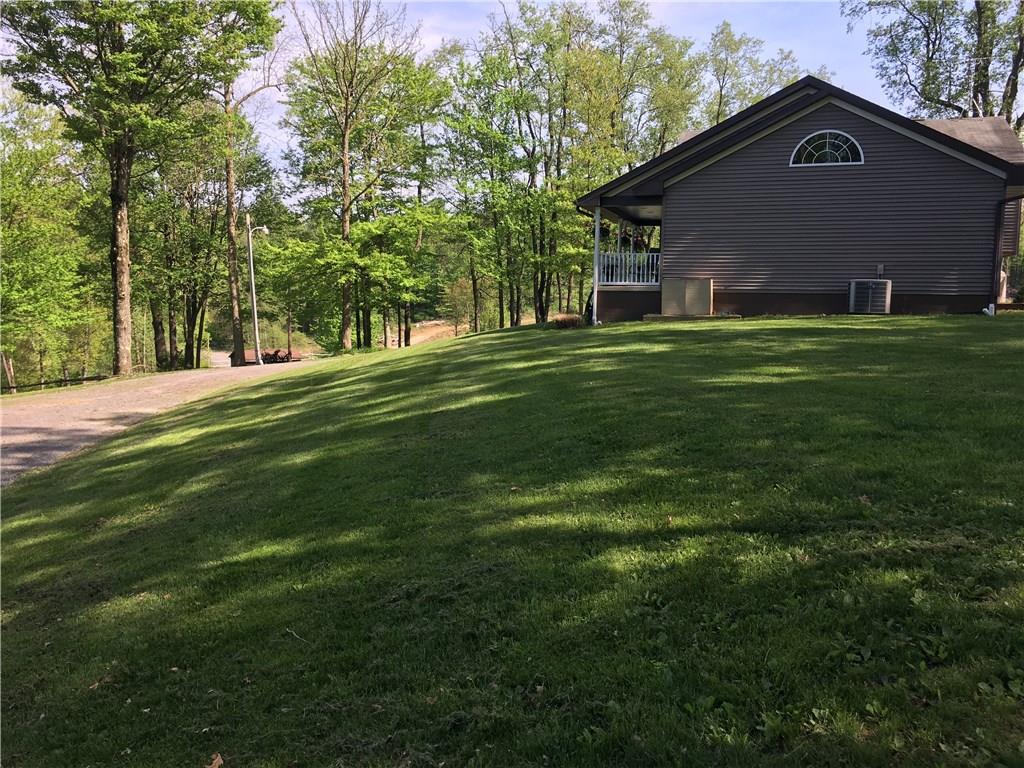 704 Red Mill Road Kittanning, PA 16201 - Photo 10 of 25 View of side of house and level side yard looking from Detached Garage!