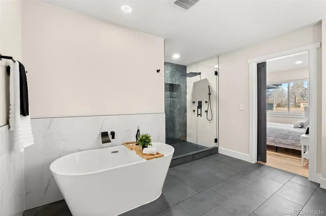 a white bath tub sitting in a bathroom