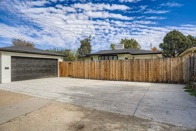 an aerial view of a house with a backyard