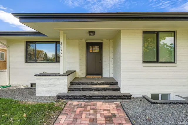 a front view of a house with a rug