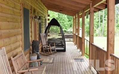 10394 Lake Royalle Road Spring Hope, NC 27882 - Photo 3 of 23 a view of balcony with chairs and wooden floor