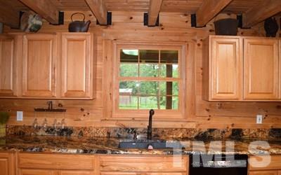 10394 Lake Royalle Road Spring Hope, NC 27882 - Photo 8 of 23 a kitchen with a window and cabinets