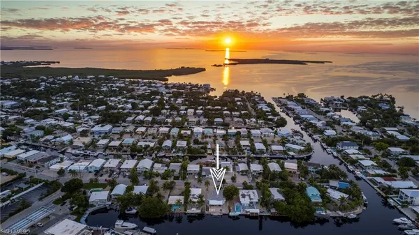 a bathroom with a sink mirror vanity and toilet