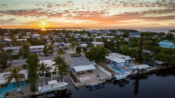 a bedroom with bed and a window