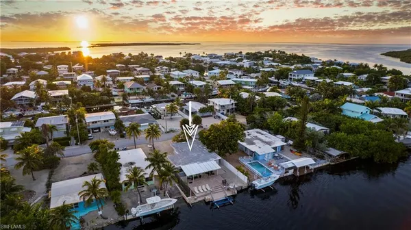 a view of a patio with swimming pool and furniture