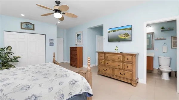 a kitchen with a refrigerator sink and cabinets