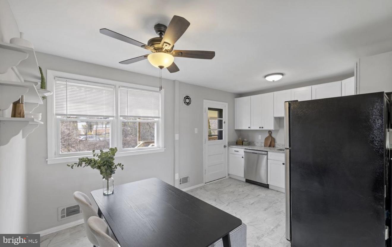 243 Highmeadow Road Reisterstown, MD 21136 - Photo 15 of 32 Bright and airy modern kitchen space.