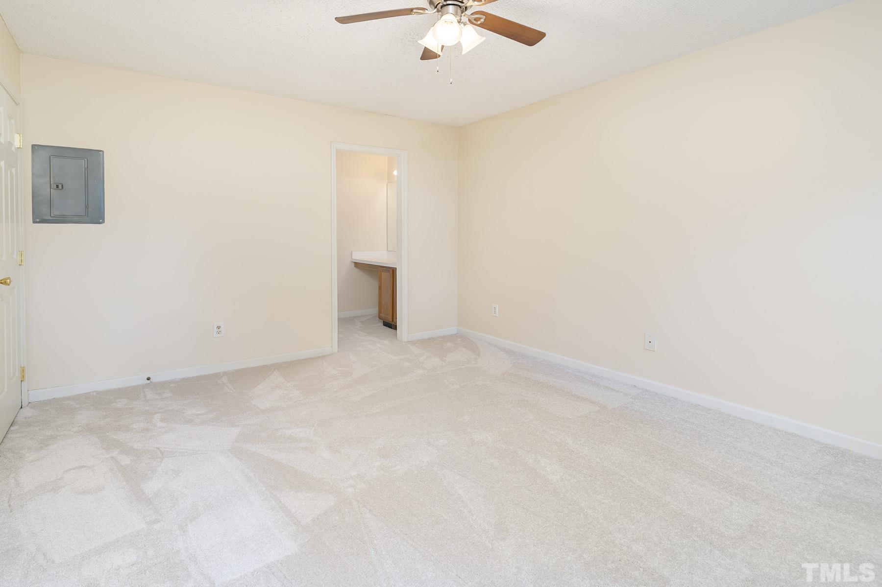 4105 Old Coach Road Raleigh, NC 27616 - Photo 14 of 22 an empty room with a ceiling fan and a window