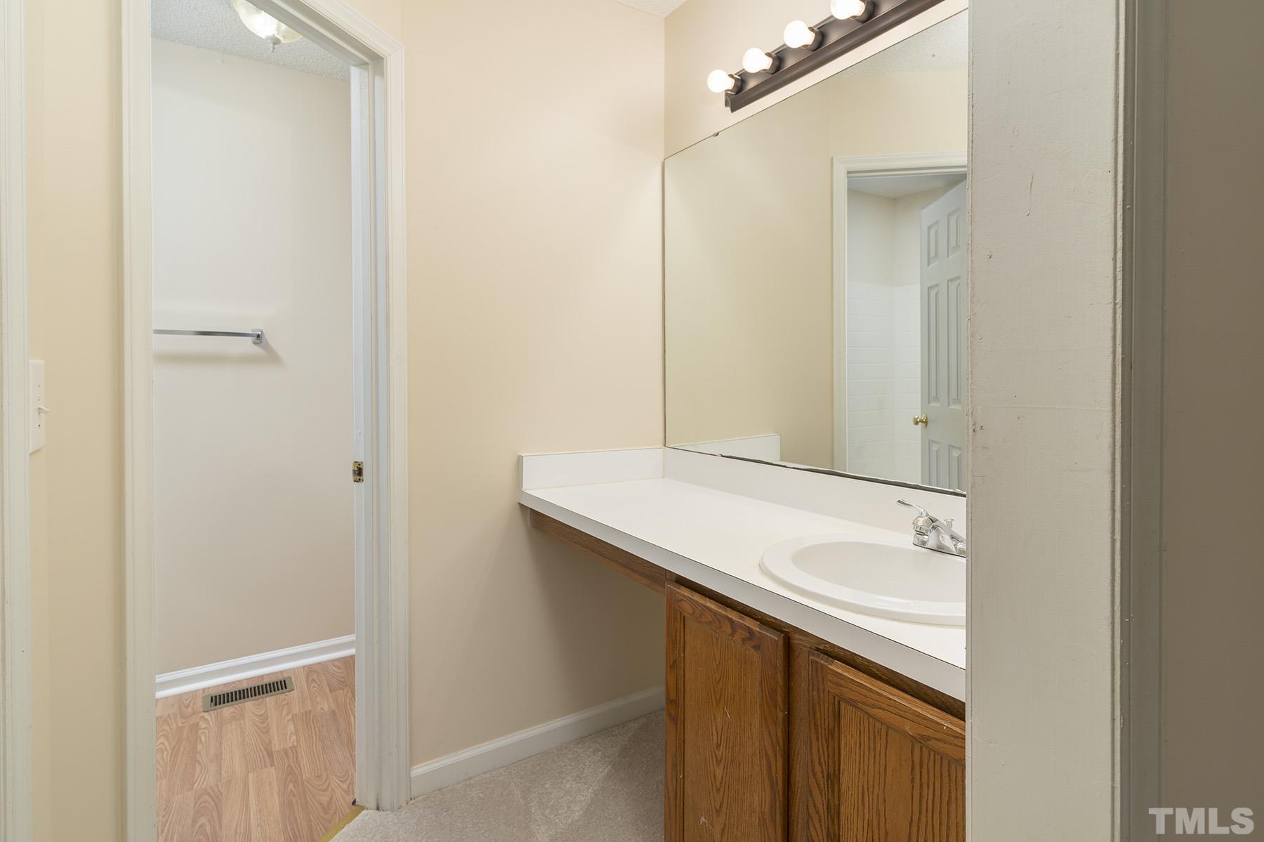 4105 Old Coach Road Raleigh, NC 27616 - Photo 15 of 22 a bathroom with a sink and a mirror