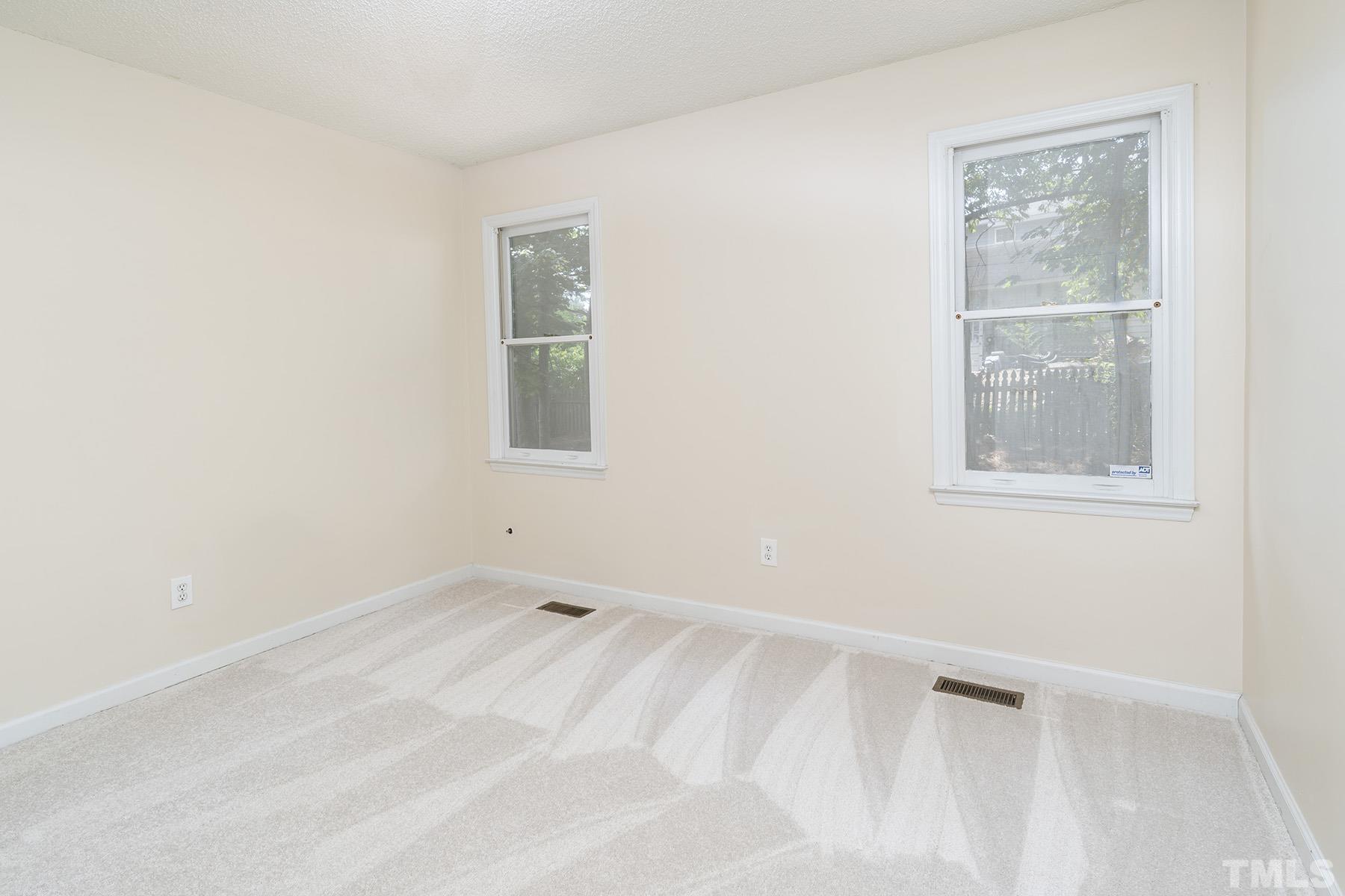 4105 Old Coach Road Raleigh, NC 27616 - Photo 17 of 22 an empty room with a window