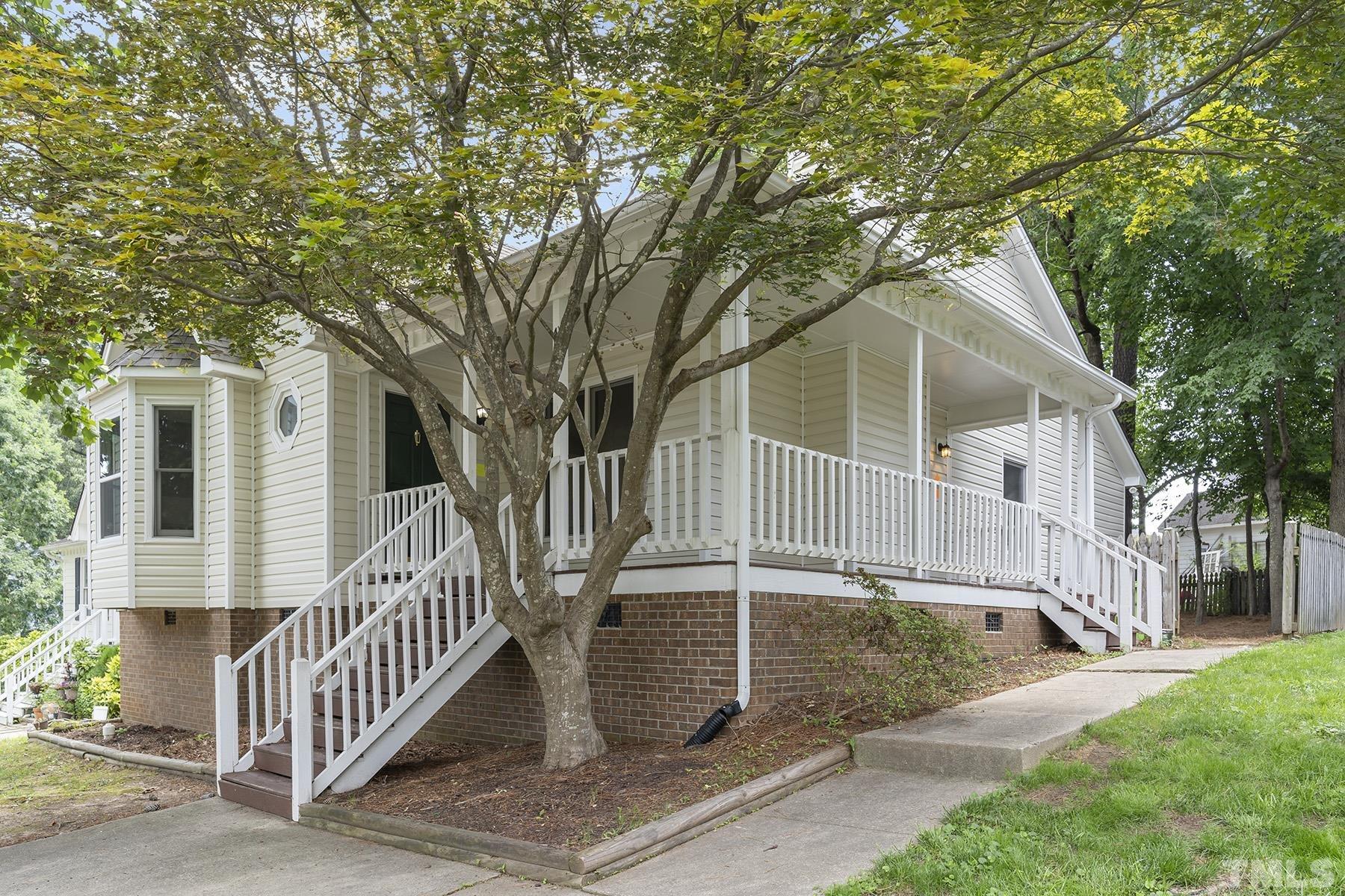 4105 Old Coach Road Raleigh, NC 27616 - Photo 3 of 22 a front view of a house with a yard