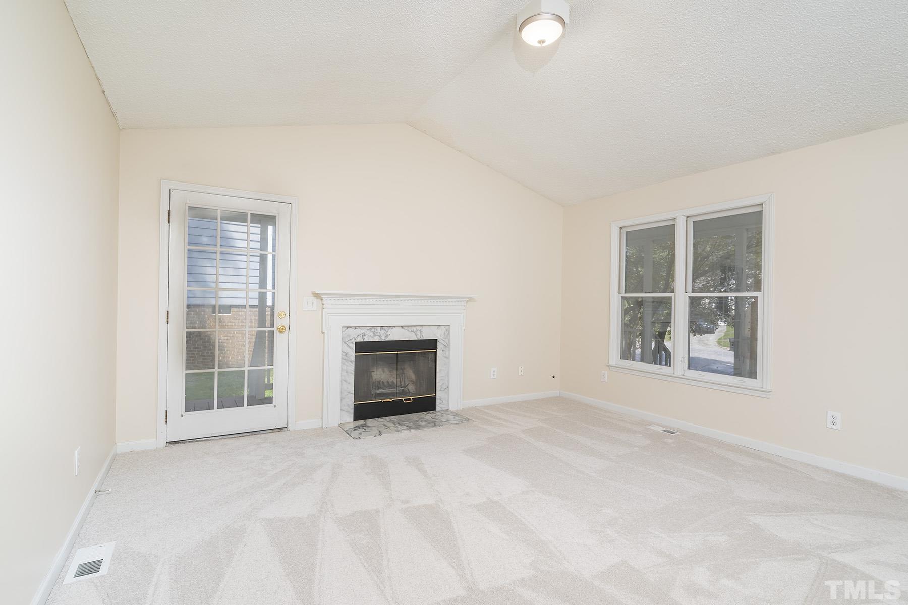 4105 Old Coach Road Raleigh, NC 27616 - Photo 7 of 22 an empty room with windows