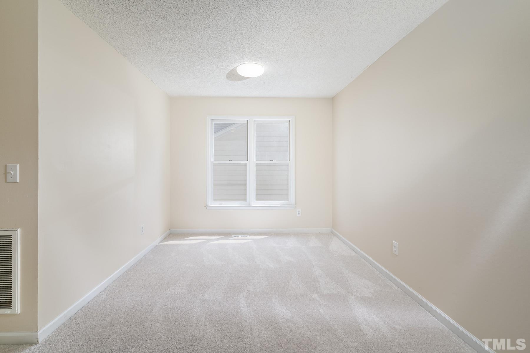 4105 Old Coach Road Raleigh, NC 27616 - Photo 8 of 22 a view of an empty room with a window