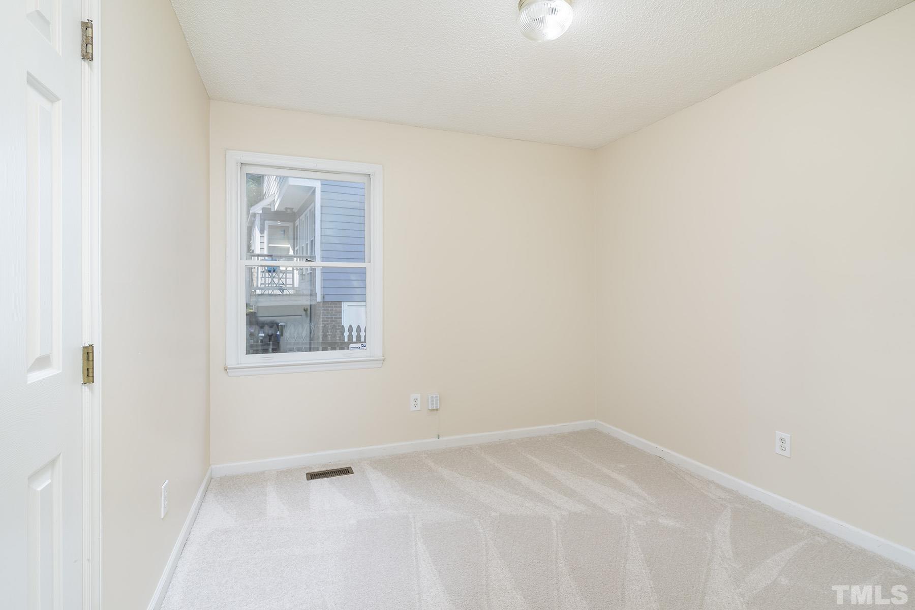4105 Old Coach Road Raleigh, NC 27616 - Photo 10 of 22 a view of an empty room with a window