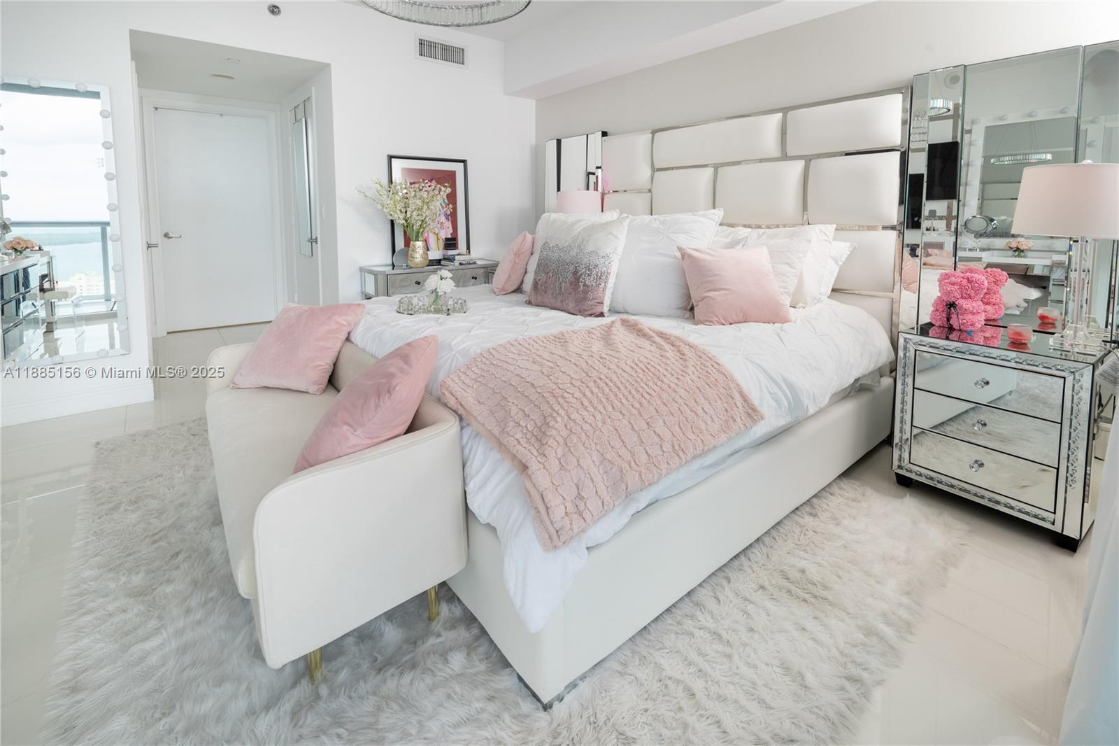 465 Brickell Avenue, Unit 4705 Miami, FL 33131 - Photo 8 of 29 a bedroom with a bed and a couch