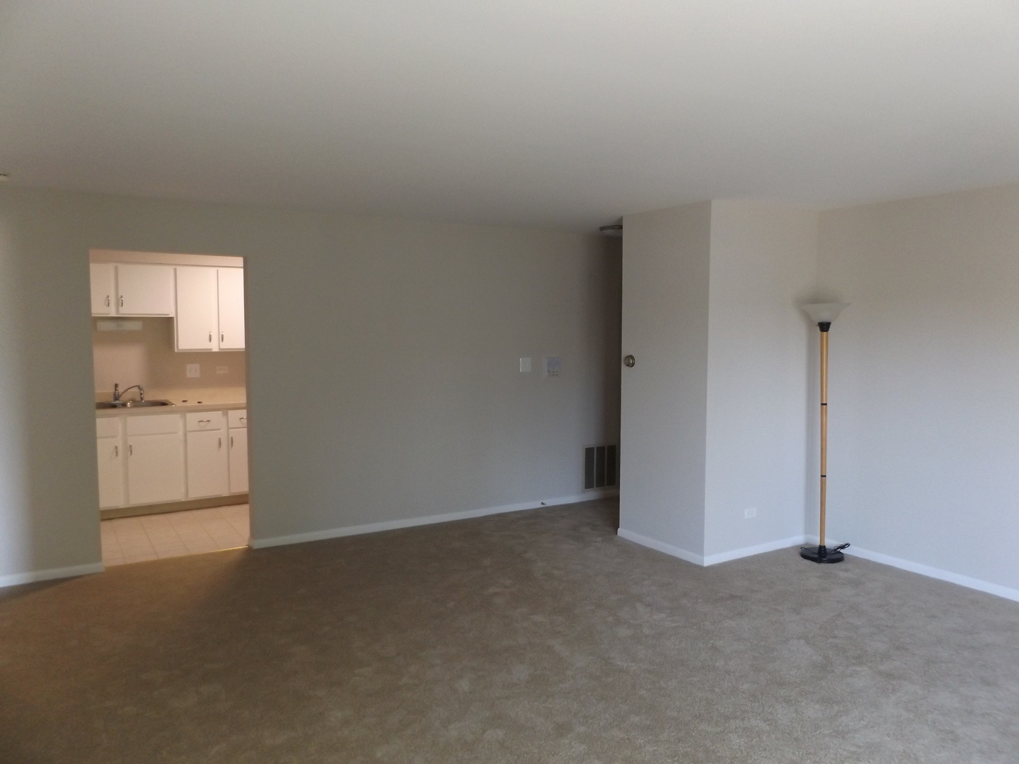613 West Central Road, Unit C1 Mount Prospect, IL 60056 - Photo 3 of 14 a view of empty room with windows