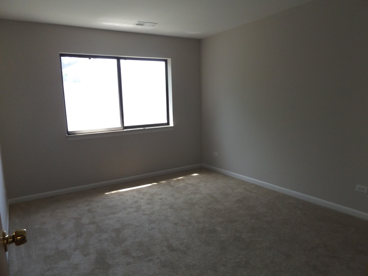 613 West Central Road, Unit C1 Mount Prospect, IL 60056 - Photo 9 of 14 an empty room with a window
