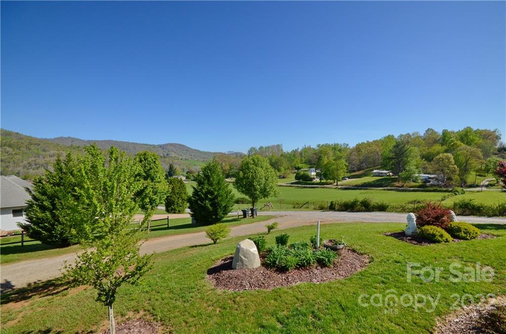 150 Triple R Drive Canton, NC 28716 - Photo 12 of 44 a view of a lake with a yard