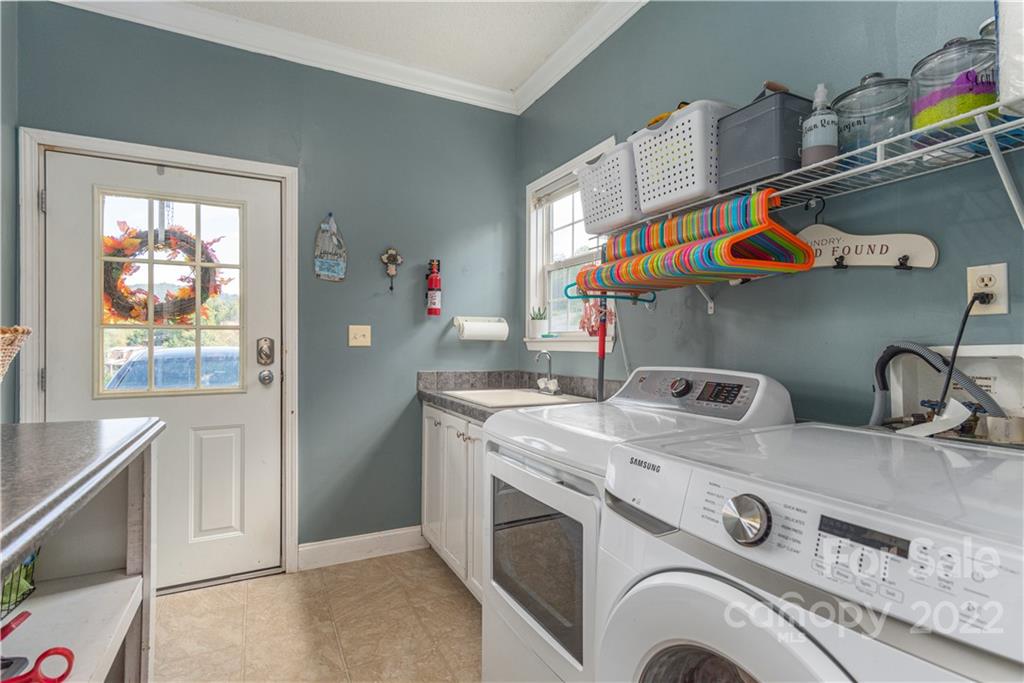 150 Triple R Drive Canton, NC 28716 - Photo 16 of 44 a utility room with dryer and washer