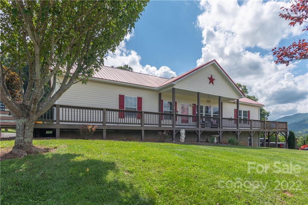 150 Triple R Drive Canton, NC 28716 - Photo 2 of 44 a view of a house with a yard and sitting area