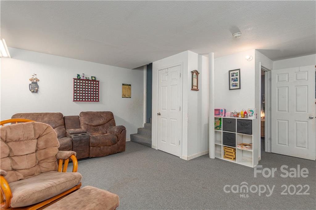 150 Triple R Drive Canton, NC 28716 - Photo 23 of 44 a living room with furniture and a window