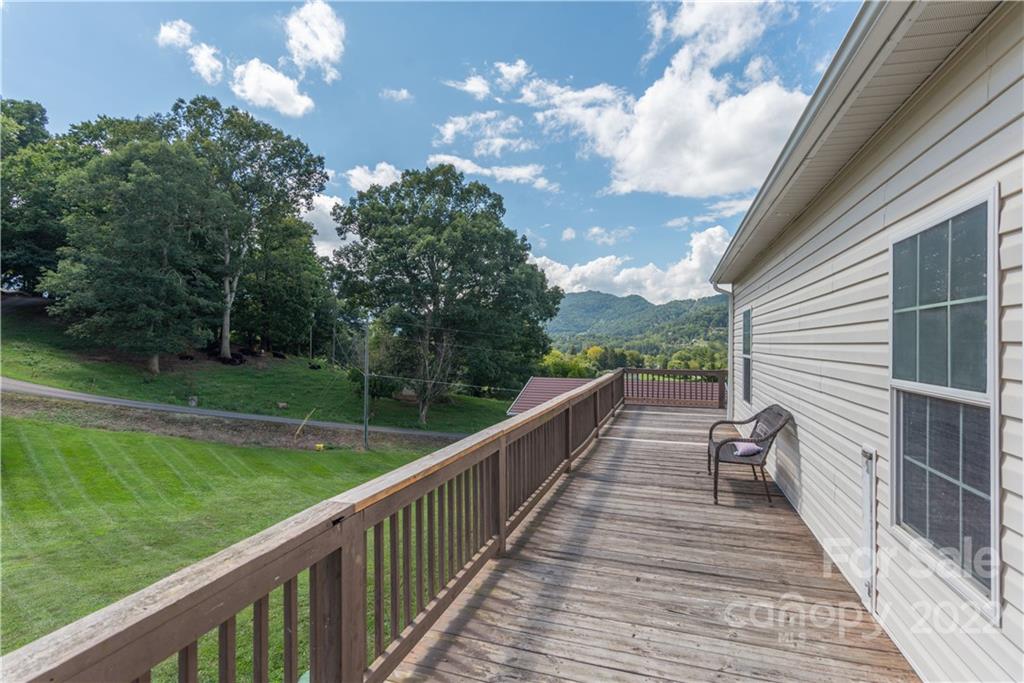 150 Triple R Drive Canton, NC 28716 - Photo 34 of 44 a view of a balcony with wooden floor and fence