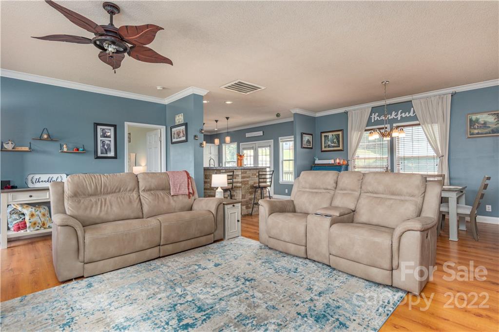 150 Triple R Drive Canton, NC 28716 - Photo 5 of 44 a living room with furniture a ceiling fan and a rug
