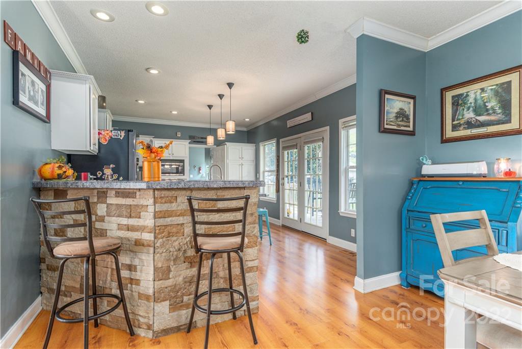 150 Triple R Drive Canton, NC 28716 - Photo 9 of 44 a dining room with furniture and wooden floor