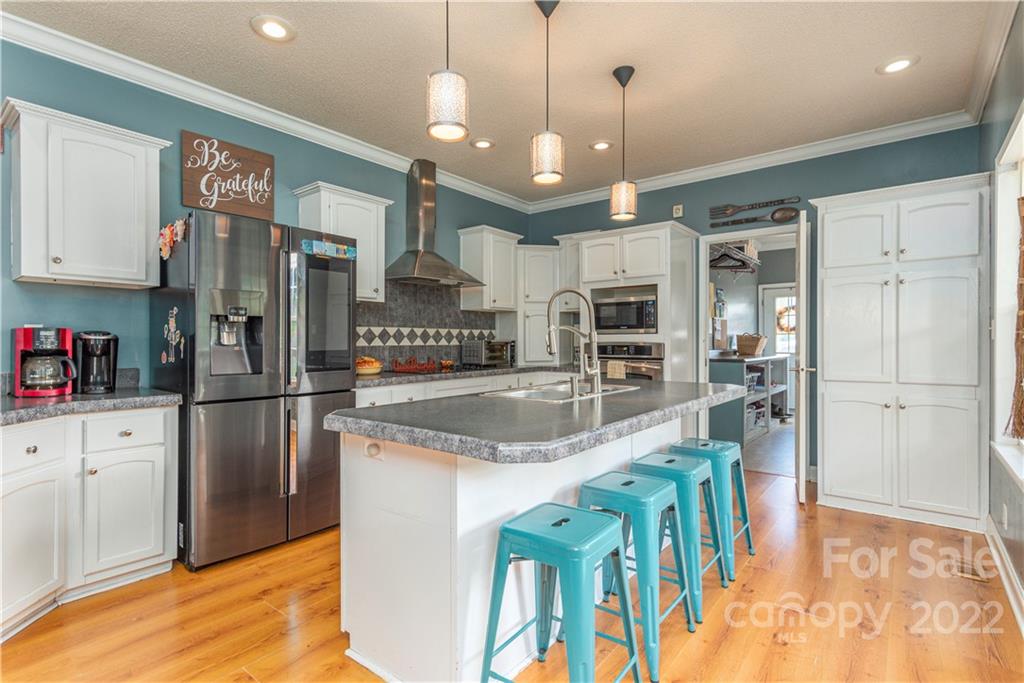 150 Triple R Drive Canton, NC 28716 - Photo 10 of 44 a kitchen with stainless steel appliances granite countertop a refrigerator and a sink