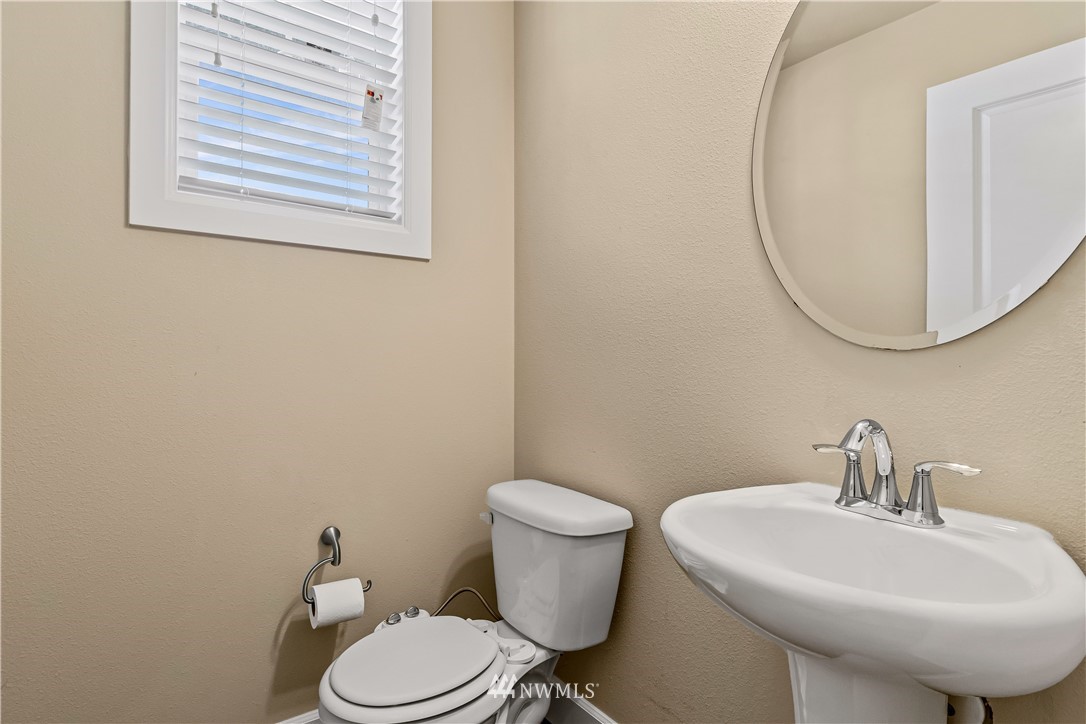 3917 174th Place Southeast Bothell, WA 98012 - Photo 12 of 31 a bathroom with a sink mirror and toilet