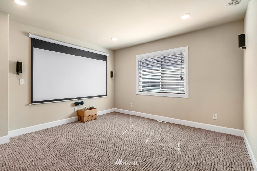 3917 174th Place Southeast Bothell, WA 98012 - Photo 15 of 31 a view of room with projector and screen