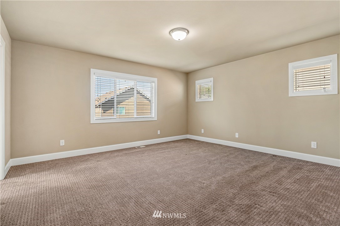 3917 174th Place Southeast Bothell, WA 98012 - Photo 17 of 31 an empty room with windows and closet