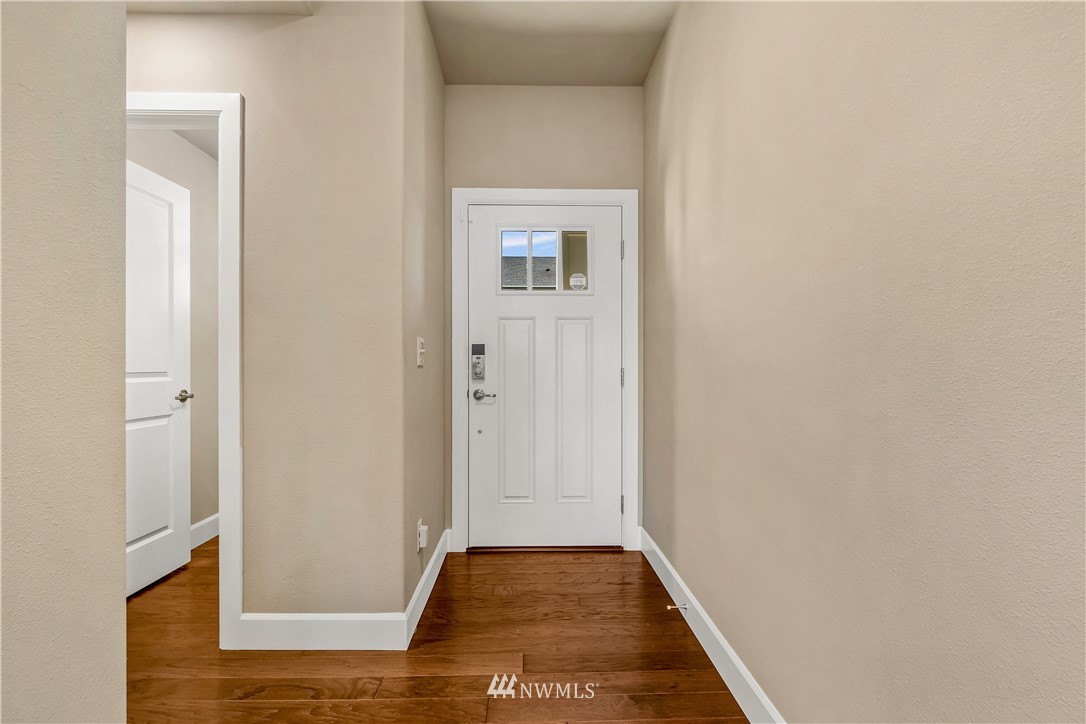 3917 174th Place Southeast Bothell, WA 98012 - Photo 3 of 31 a view of hallway with wooden floor