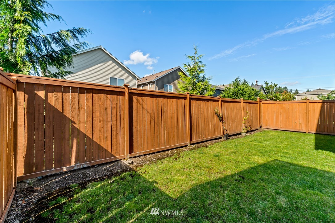 3917 174th Place Southeast Bothell, WA 98012 - Photo 27 of 31 a view of a backyard with wooden fence