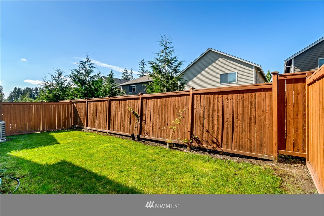 3917 174th Place Southeast Bothell, WA 98012 - Photo 28 of 31 a view of an house with backyard and garden