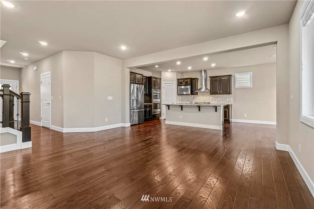 3917 174th Place Southeast Bothell, WA 98012 - Photo 6 of 31 a view of kitchen with cabinets and wooden floor
