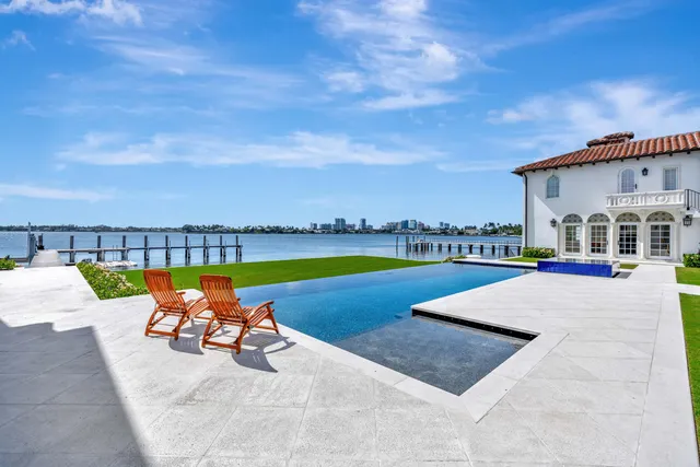 a view of a swimming pool with a lounge chair